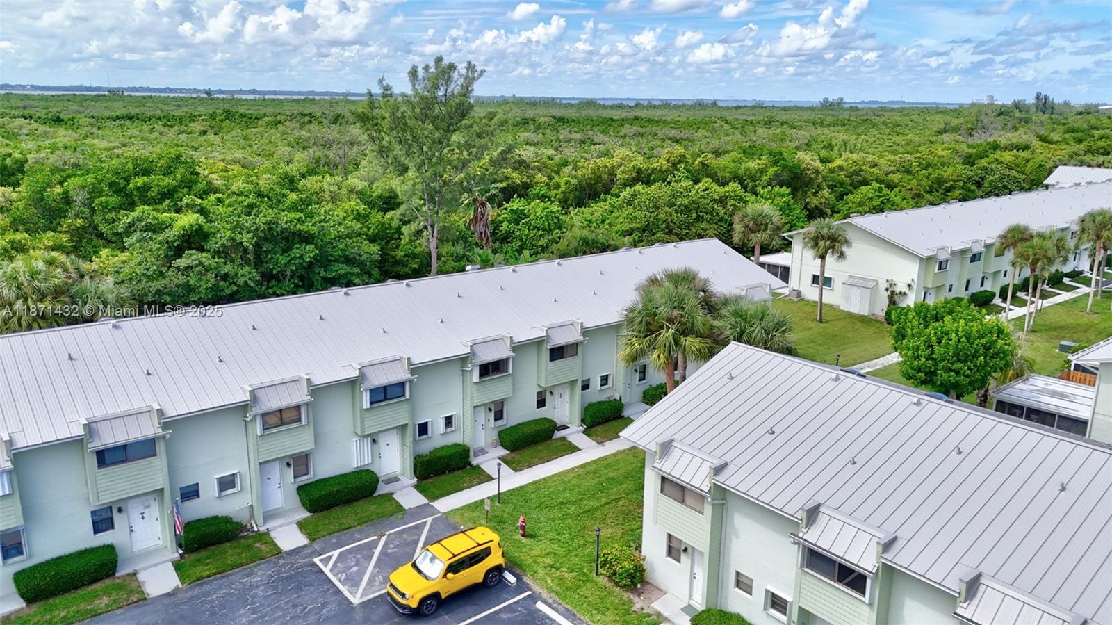 9421 South Ocean Drive, Unit 90 Jensen Beach, FL 34957 - Photo 35 of 49 an aerial view of a house with garden space and street view