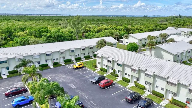an outdoor space with seating area and trees