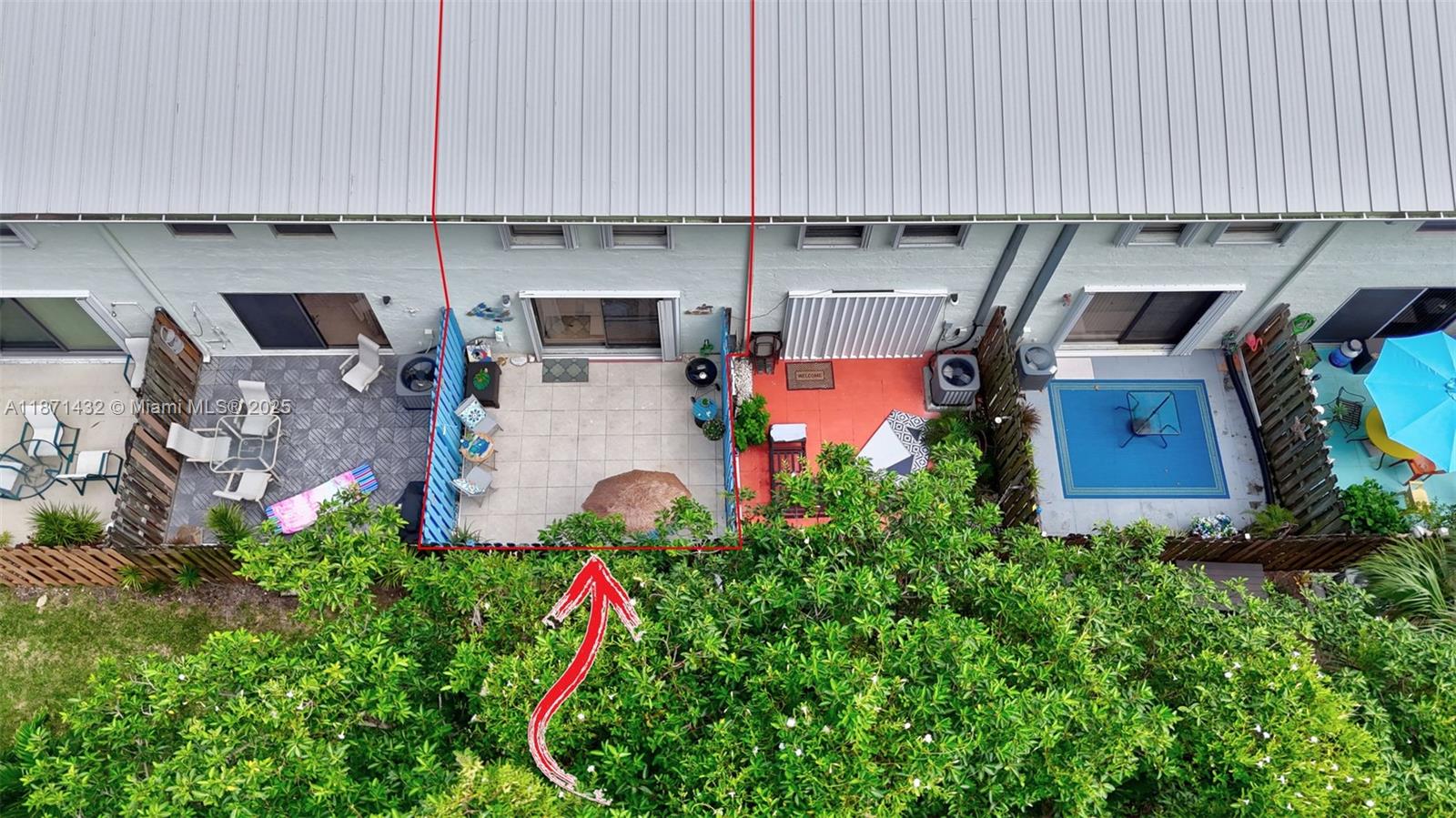 9421 South Ocean Drive, Unit 90 Jensen Beach, FL 34957 - Photo 45 of 49 an outdoor space with seating area and trees