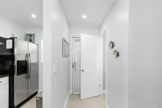 a bathroom with a shower and a glass door