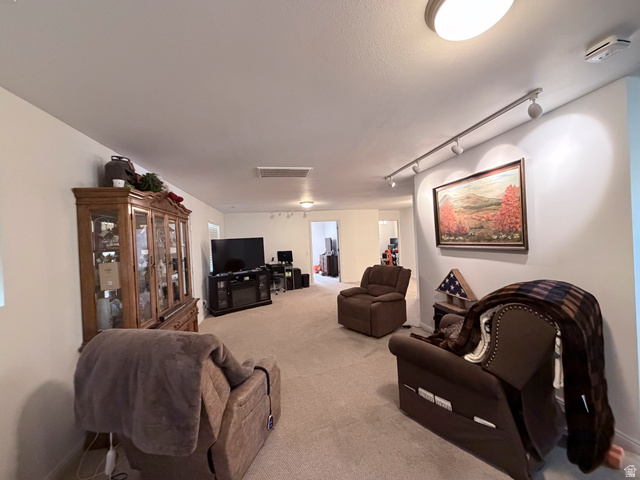 2855 South 1000 West Perry, UT 84302 - Photo 100 of 142 Living room featuring rail lighting and light colored carpet