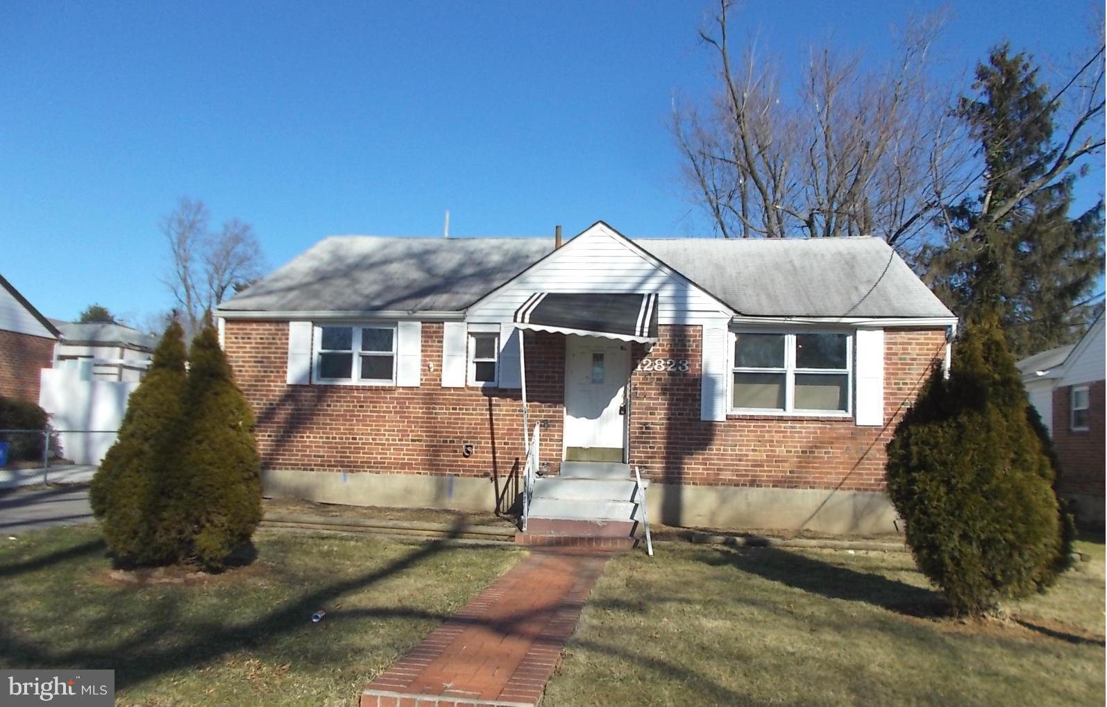 12823 Matey Road Silver Spring, MD 20906 - Photo 1 of 14 a front view of a house with a yard