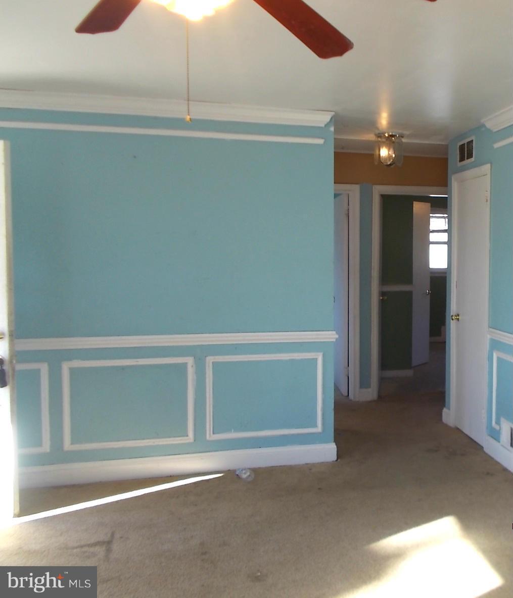 12823 Matey Road Silver Spring, MD 20906 - Photo 4 of 14 a view of an empty room with wooden floor