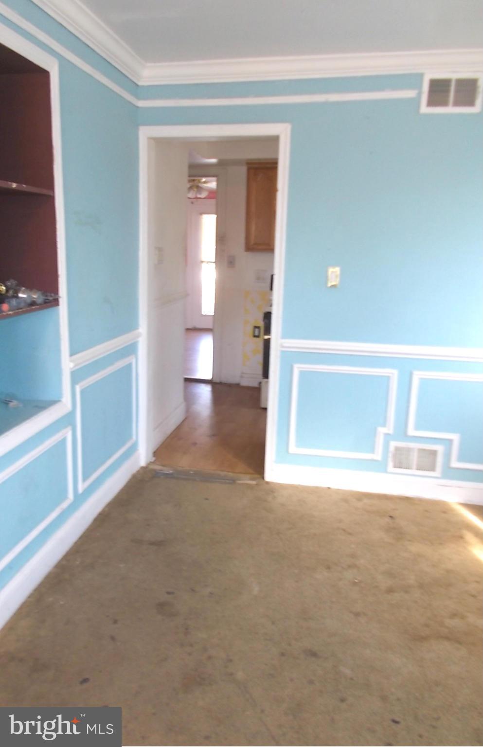 12823 Matey Road Silver Spring, MD 20906 - Photo 5 of 14 view of an empty room with wooden floor and a window