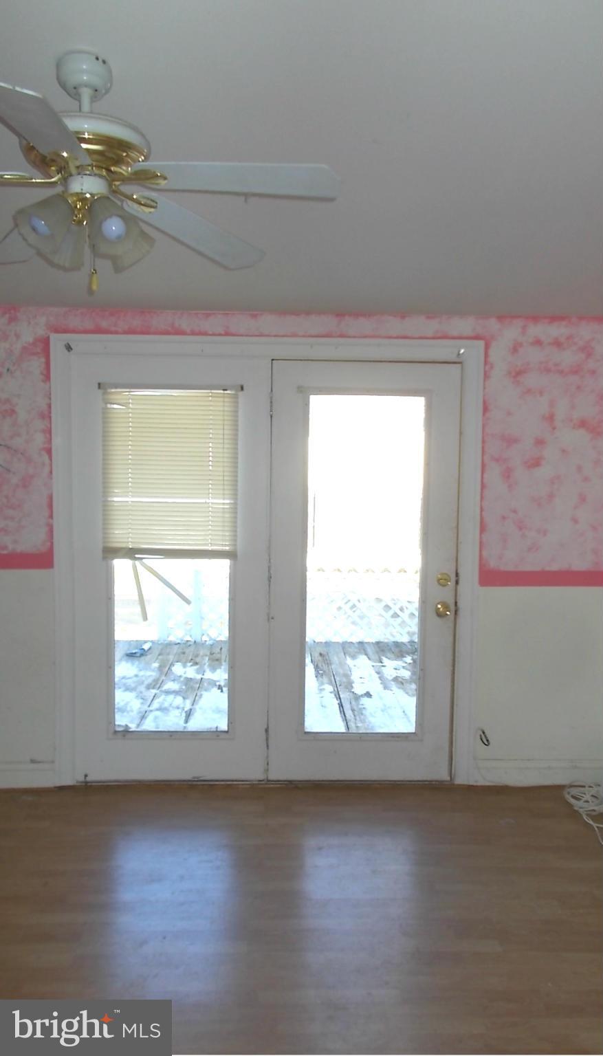 12823 Matey Road Silver Spring, MD 20906 - Photo 9 of 14 a view of lot of window and wooden floor