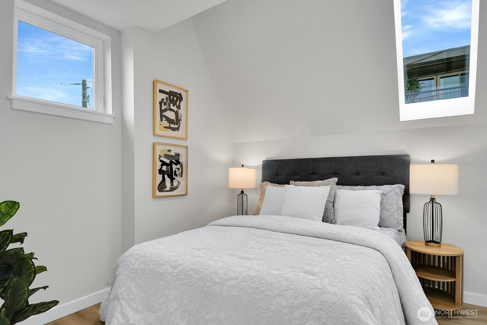 261 East Louisa Street Seattle, WA 98102 - Photo 12 of 24 a bedroom with a bed and painting on the wall