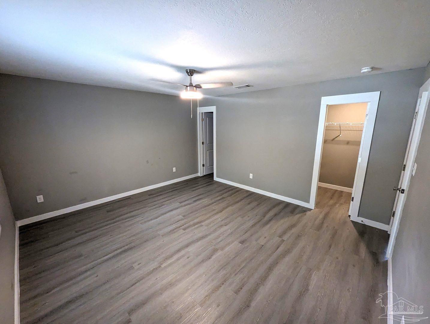 6045 Hamilton Bridge Road Milton, FL 32570 - Photo 18 of 31 wooden floor in an empty room