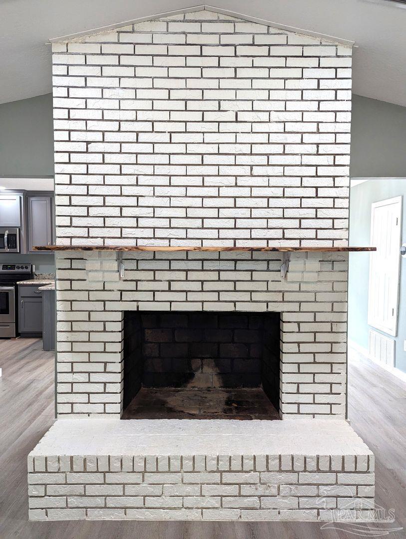 6045 Hamilton Bridge Road Milton, FL 32570 - Photo 5 of 31 a building with a fireplace