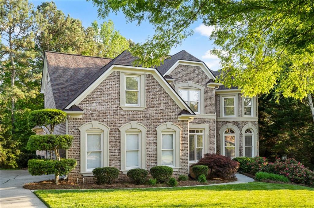 4580 Regency Trace Atlanta, GA 30331 - Photo 1 of 1 a front view of a house with a yard garage and outdoor seating
