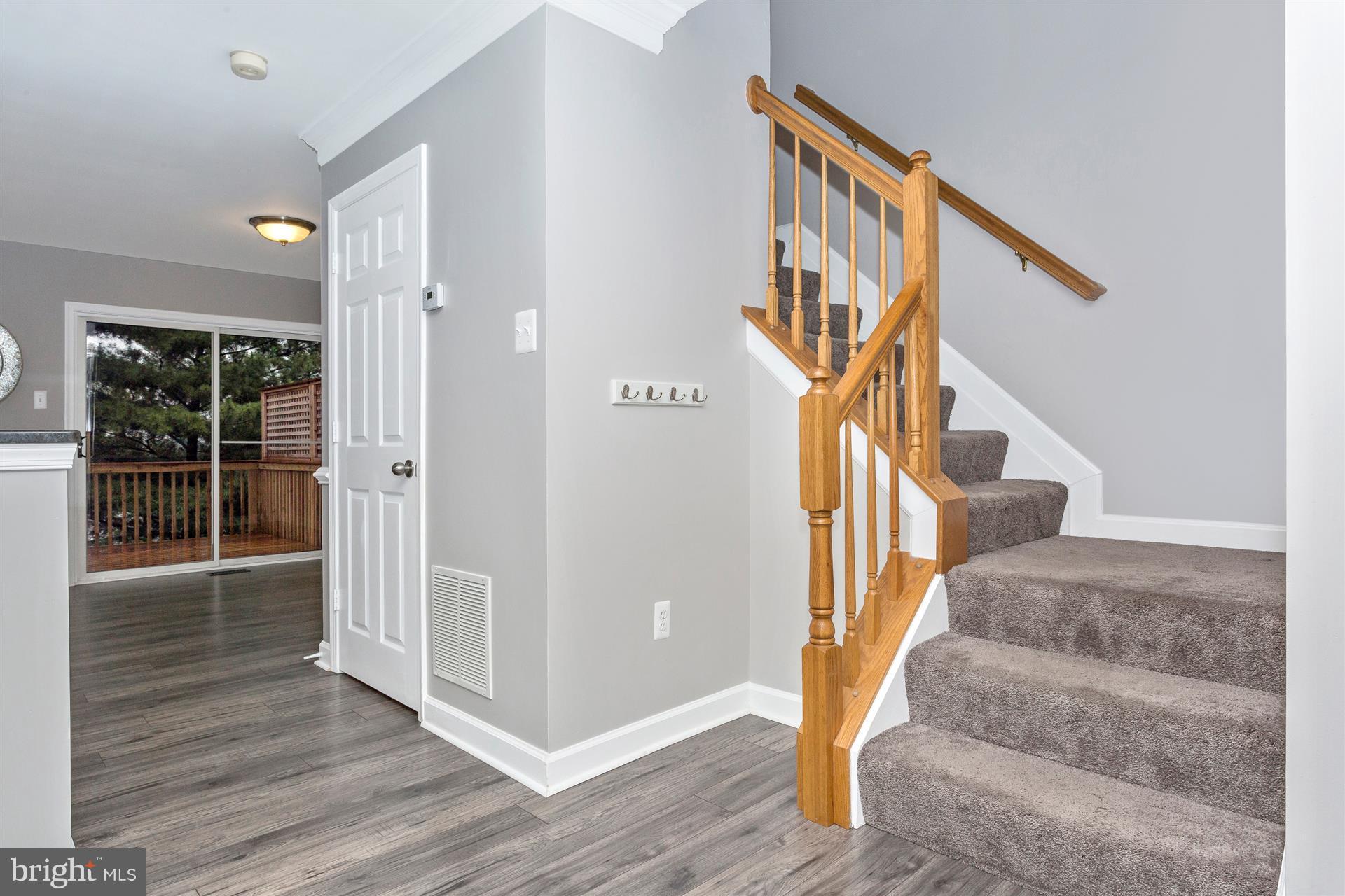 6408 View Point Court Frederick, MD 21703 - Photo 12 of 30 a view of entryway and hall with wooden floor