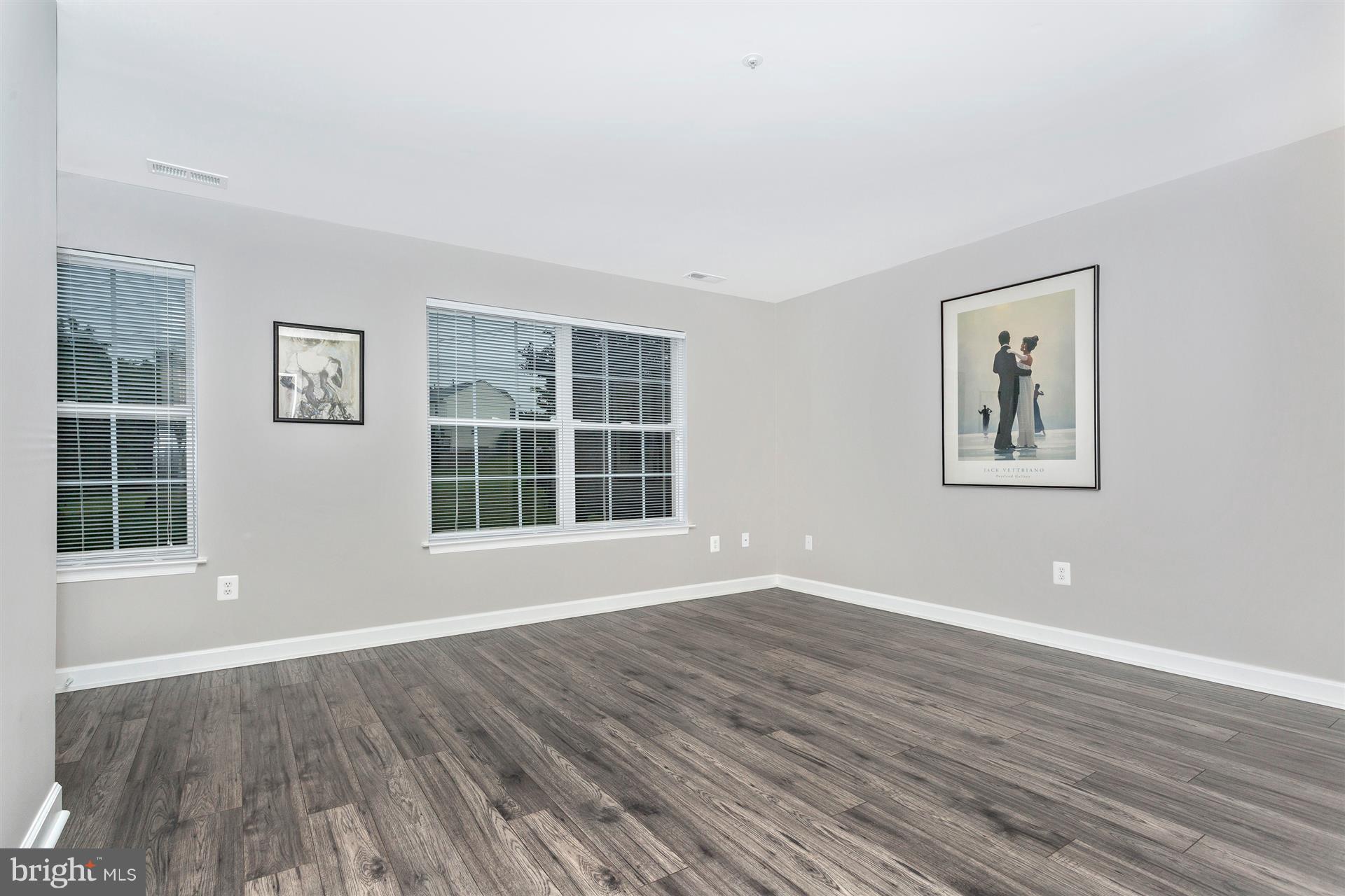6408 View Point Court Frederick, MD 21703 - Photo 18 of 30 a view of wooden floor and windows in a room