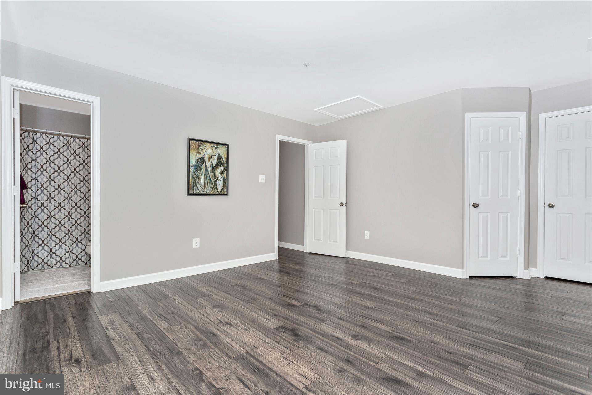 6408 View Point Court Frederick, MD 21703 - Photo 19 of 30 a view of an empty room with wooden floor