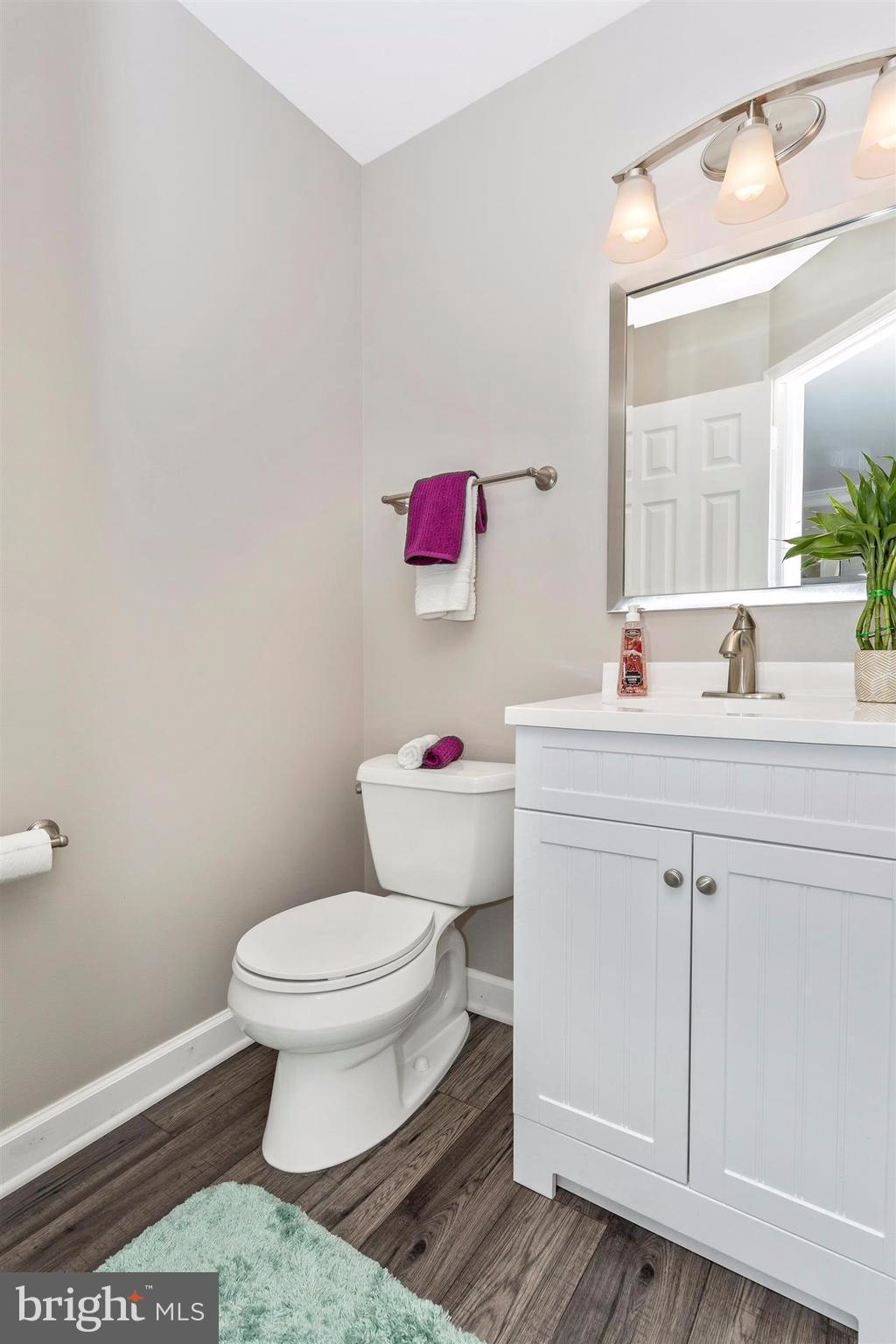 6408 View Point Court Frederick, MD 21703 - Photo 3 of 30 a bathroom with a sink toilet vanity and mirror