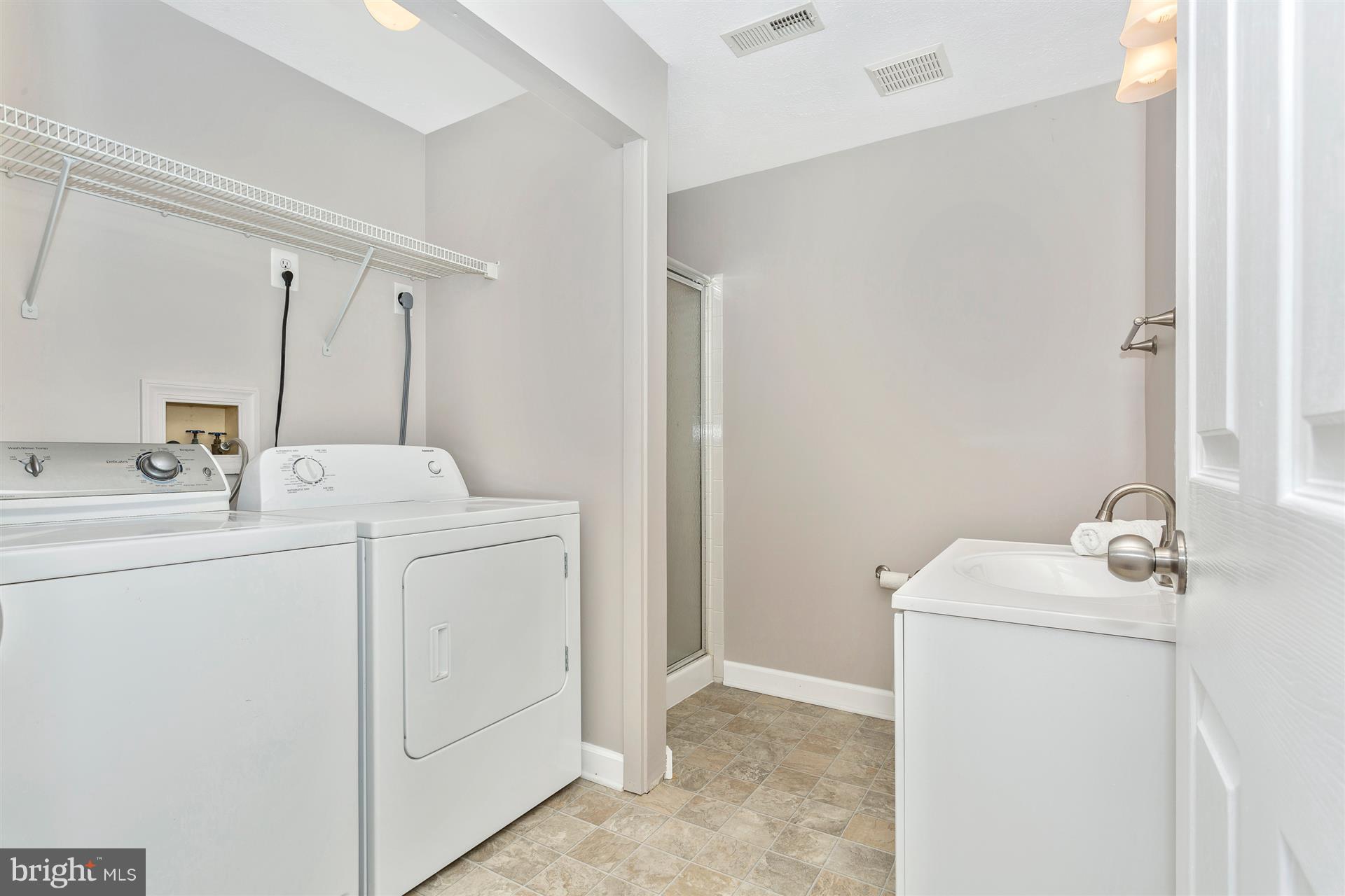 6408 View Point Court Frederick, MD 21703 - Photo 22 of 30 a utility room with dryer and washer