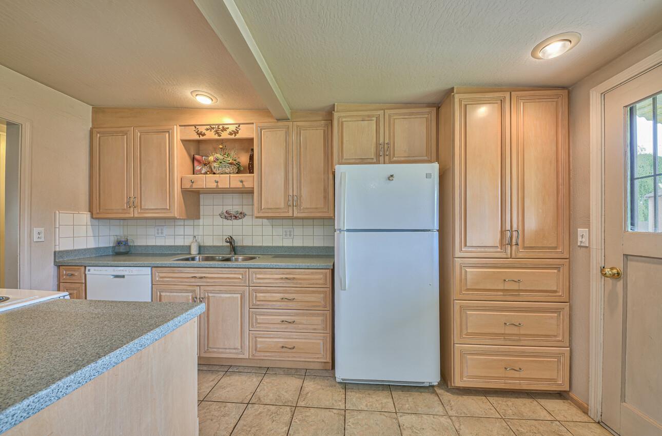 759 Middlefield Road Salinas, CA 93906 - Photo 14 of 26 a kitchen with a refrigerator sink and cabinets
