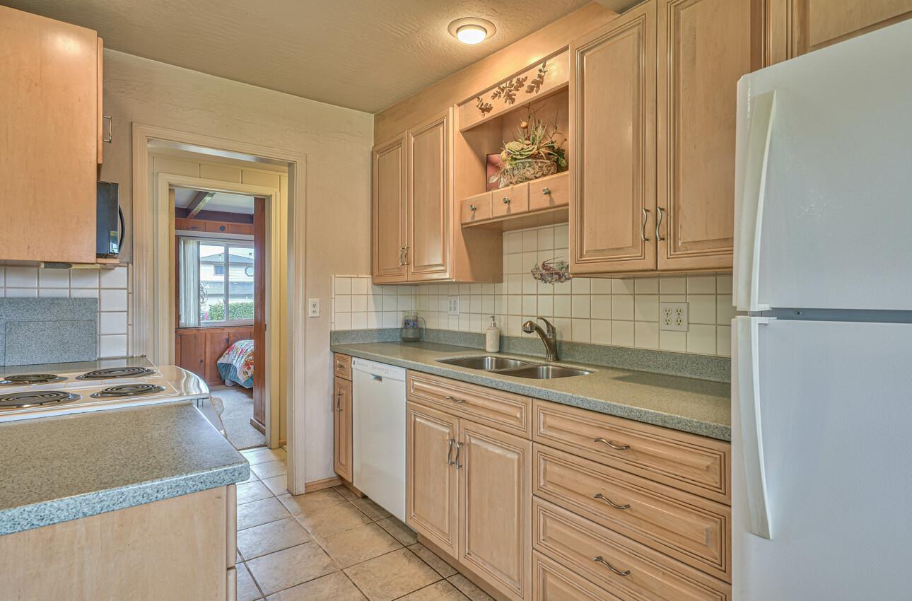 759 Middlefield Road Salinas, CA 93906 - Photo 15 of 26 a kitchen with stainless steel appliances granite countertop a sink stove and refrigerator
