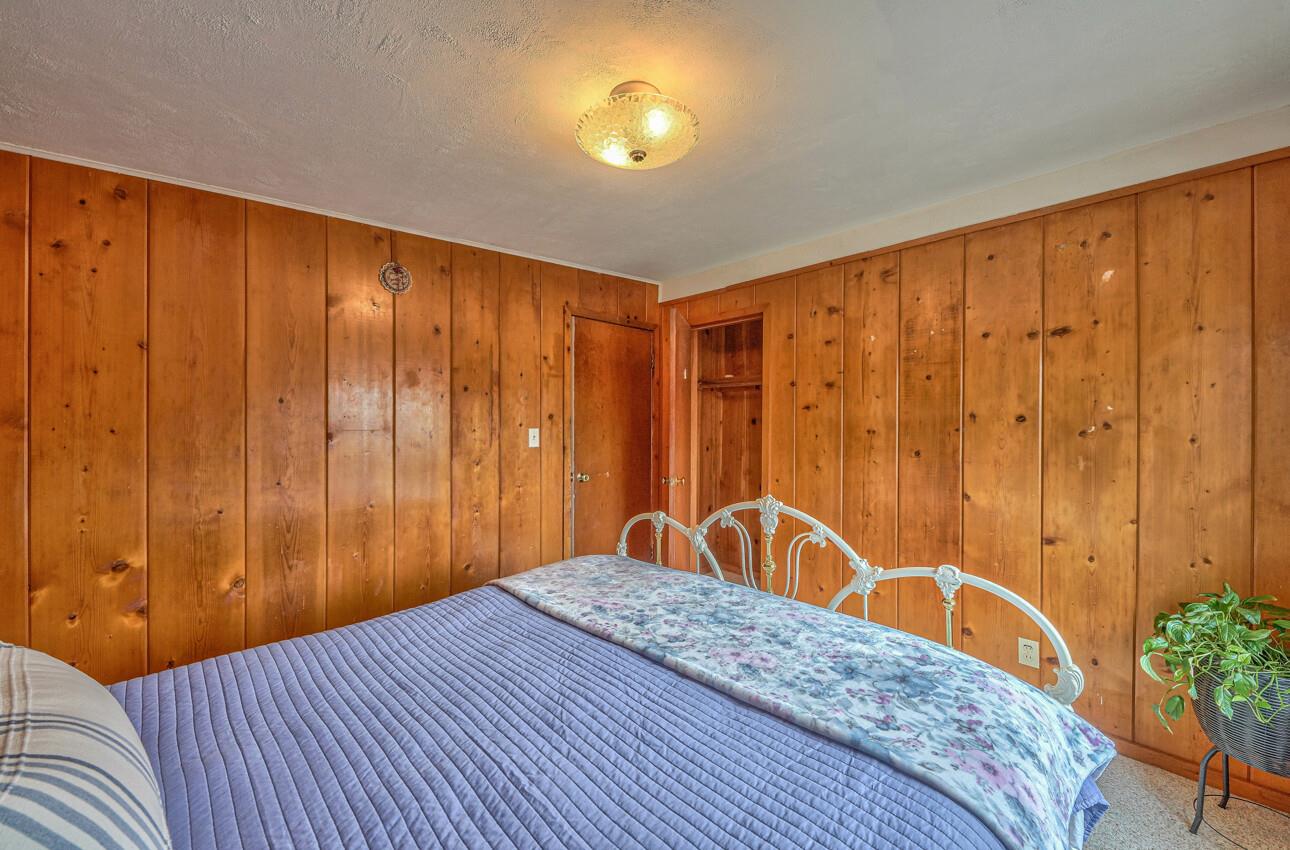 759 Middlefield Road Salinas, CA 93906 - Photo 18 of 26 a bedroom with a bed and a dresser next to a window
