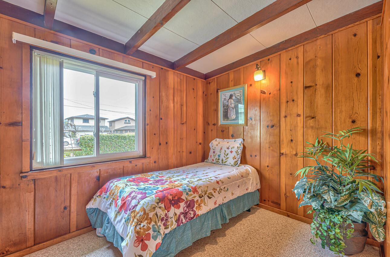 759 Middlefield Road Salinas, CA 93906 - Photo 21 of 26 a bedroom with a bed and a potted plant