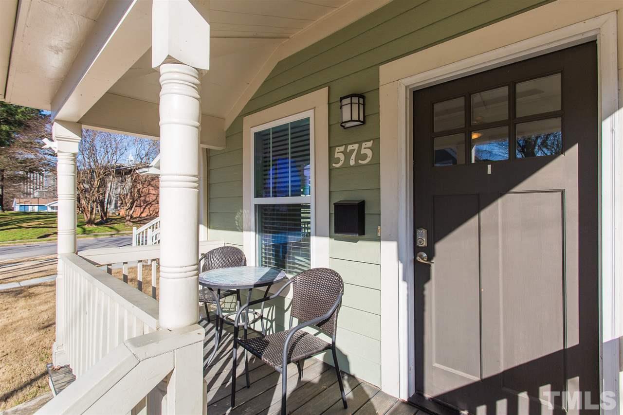 575 East Cabarrus Street Raleigh, NC 27601 - Photo 2 of 20 a balcony view with a table and chairs and potted plants