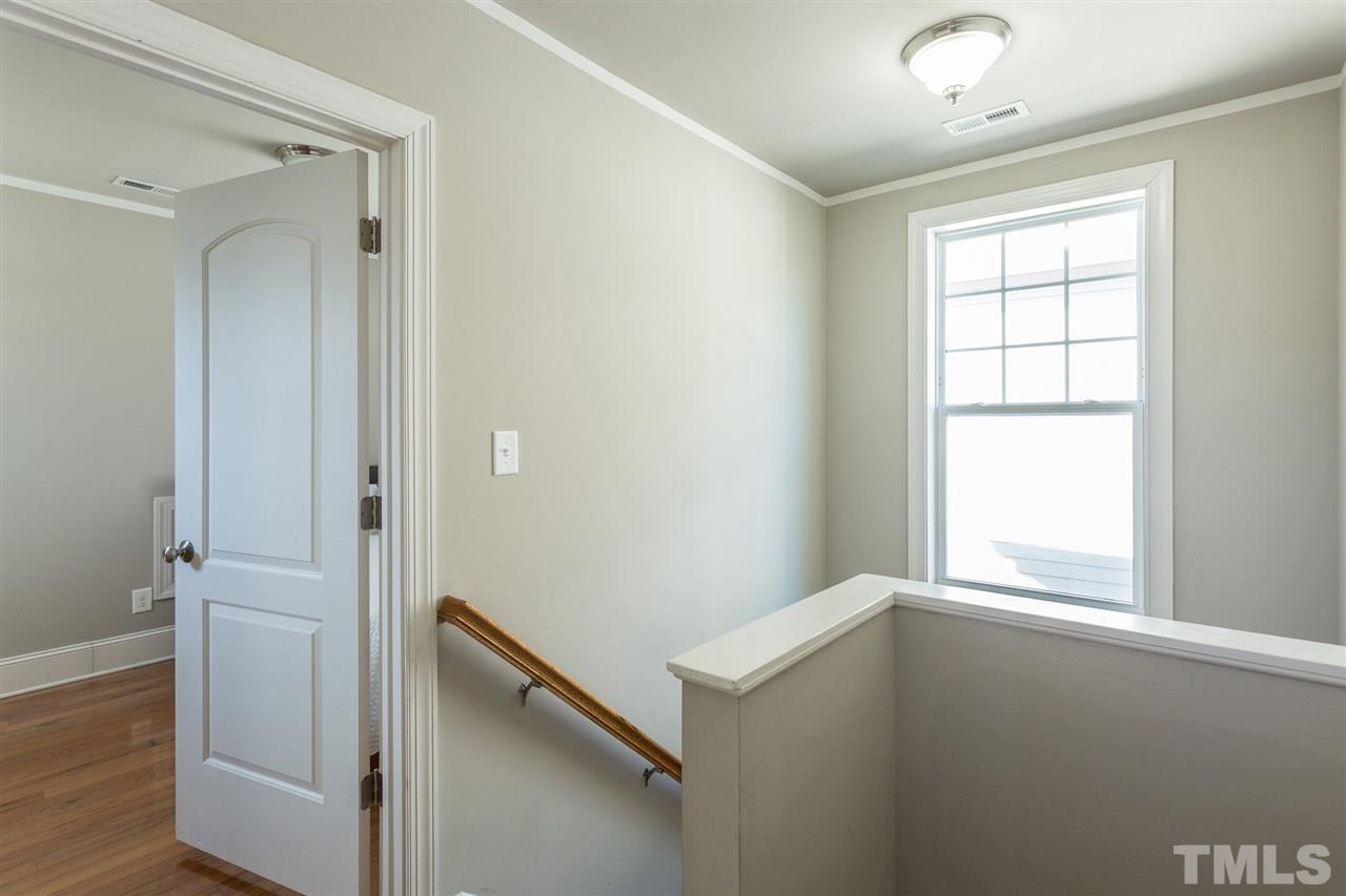 575 East Cabarrus Street Raleigh, NC 27601 - Photo 11 of 20 a view of an empty room with wooden floor and a window