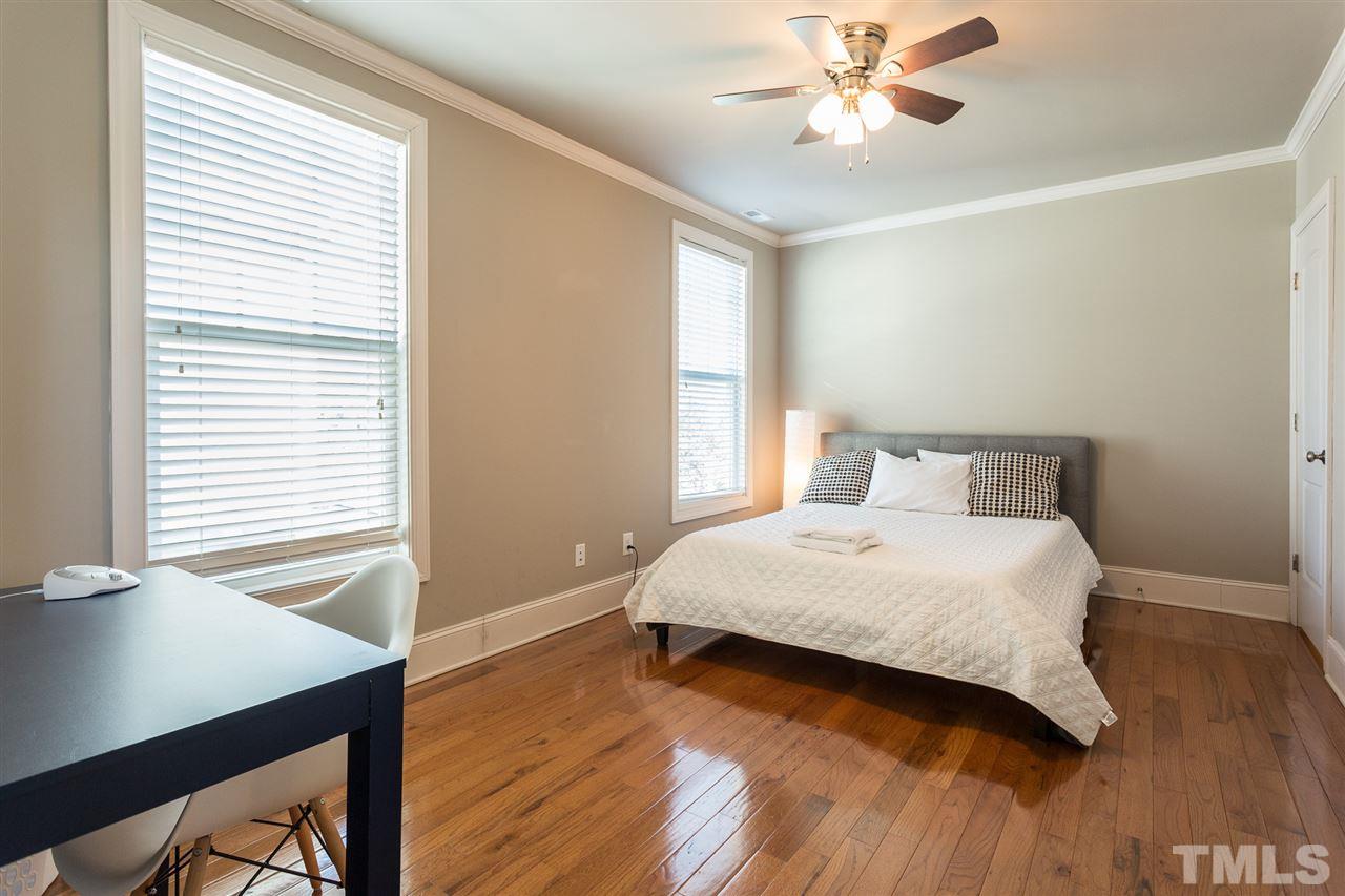 575 East Cabarrus Street Raleigh, NC 27601 - Photo 13 of 20 a bedroom with a bed and a window