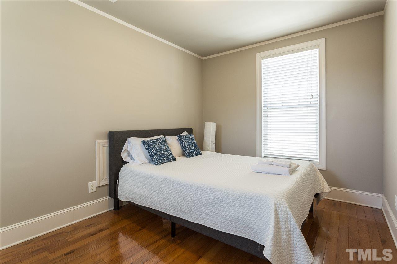 575 East Cabarrus Street Raleigh, NC 27601 - Photo 16 of 20 a bedroom with a bed and a window