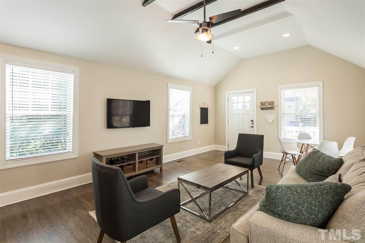 575 East Cabarrus Street Raleigh, NC 27601 - Photo 7 of 20 a living room with furniture and a flat screen tv