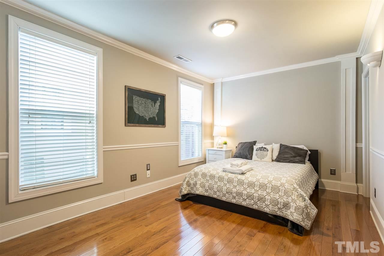 575 East Cabarrus Street Raleigh, NC 27601 - Photo 9 of 20 a bedroom with a bed and a window