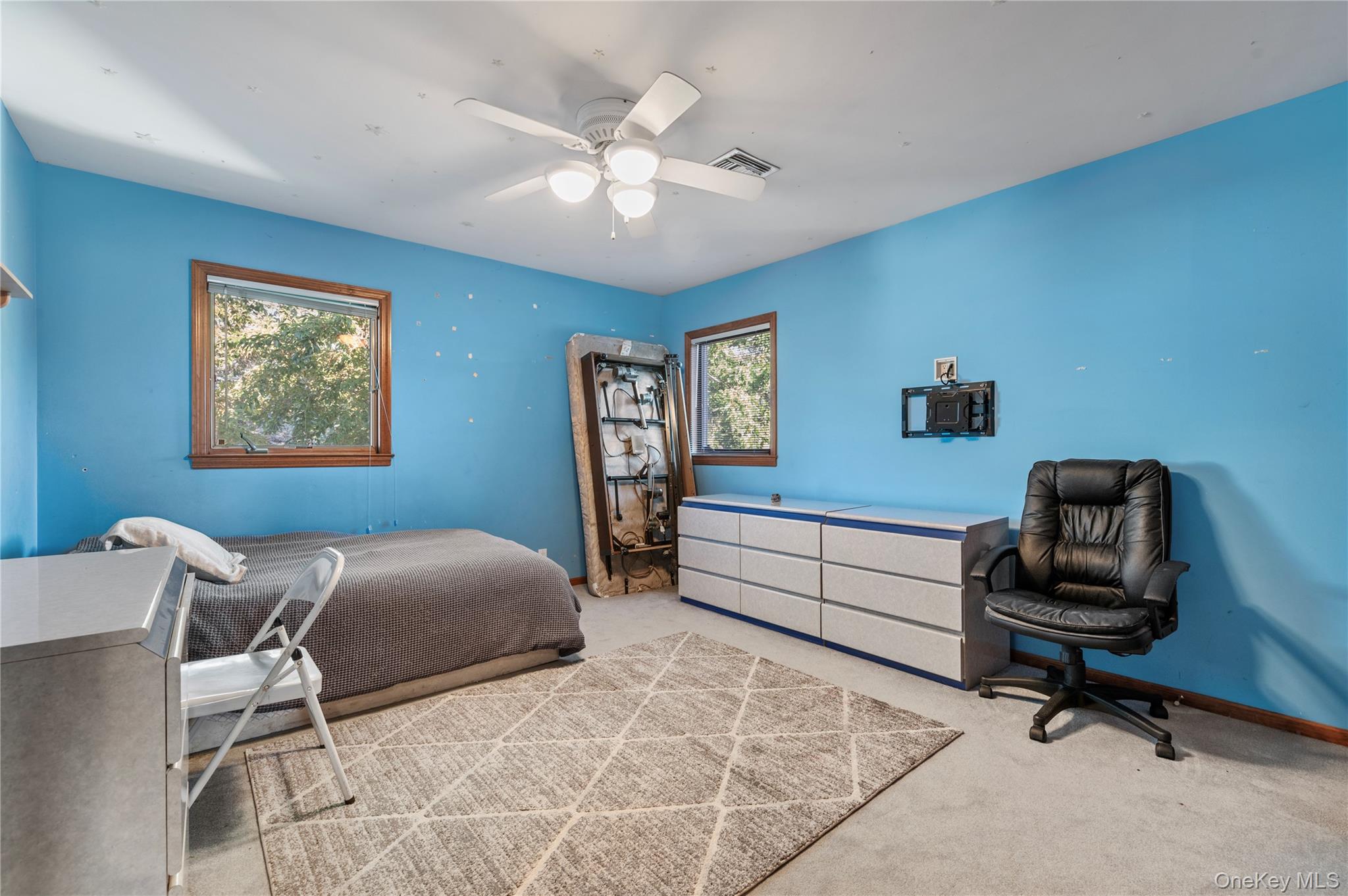 287 East Rockaway Road Hewlett, NY 11557 - Photo 16 of 25 a bedroom with furniture and a window