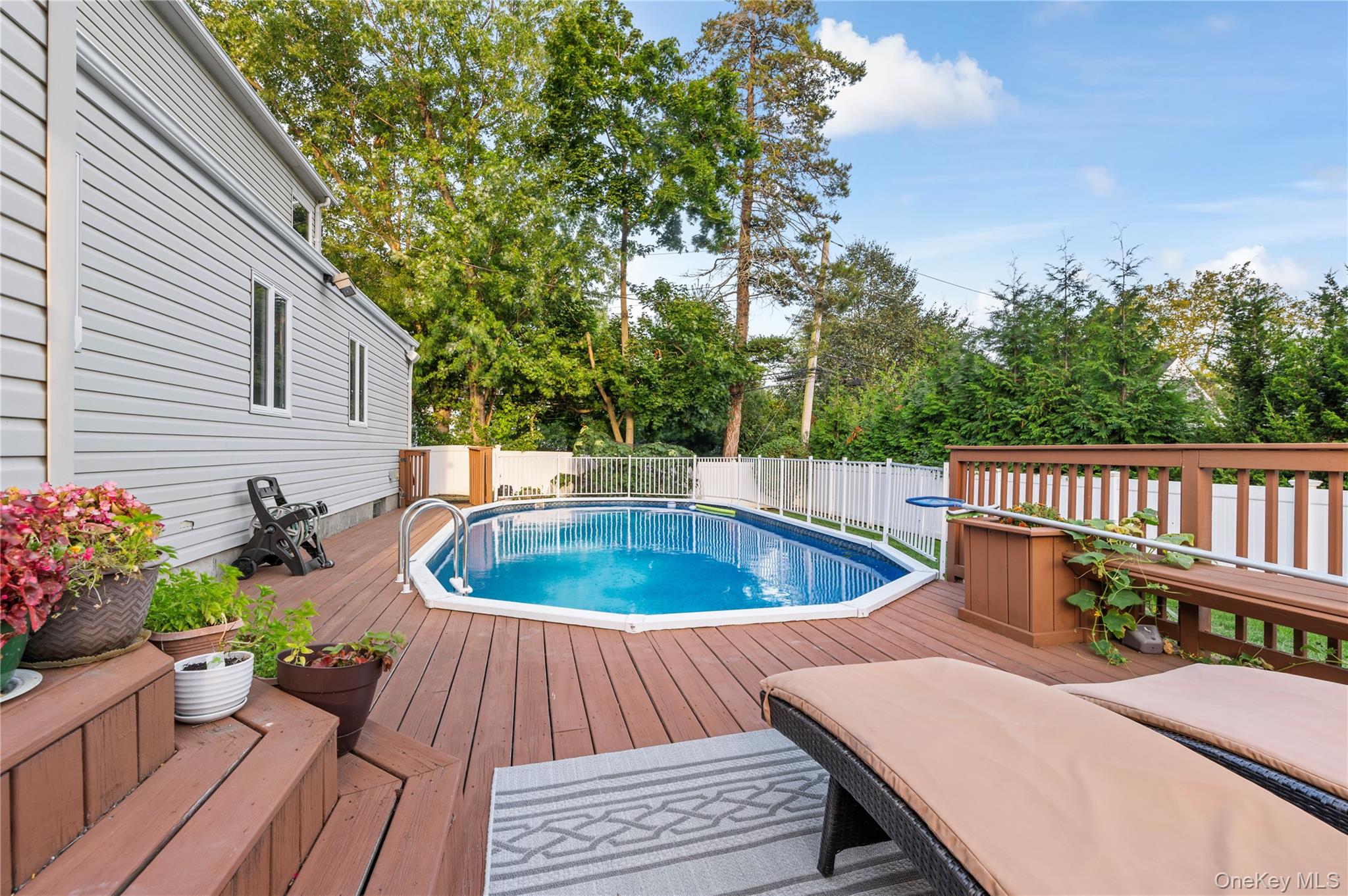 287 East Rockaway Road Hewlett, NY 11557 - Photo 19 of 25 a view of a chairs and table in the balcony
