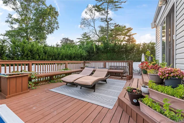 a view of a wooden deck with furniture
