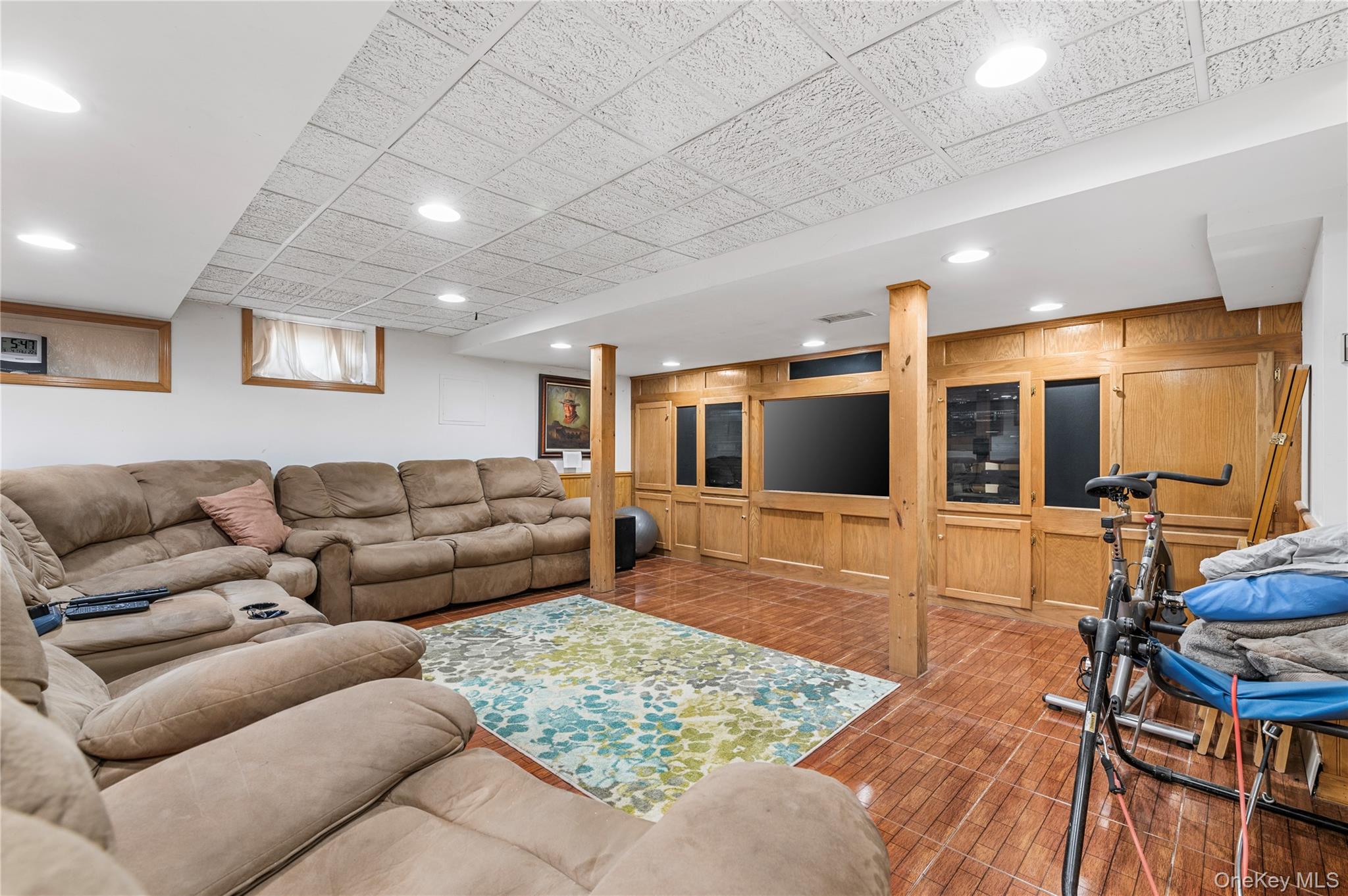 287 East Rockaway Road Hewlett, NY 11557 - Photo 9 of 25 a living room with furniture and a flat screen tv