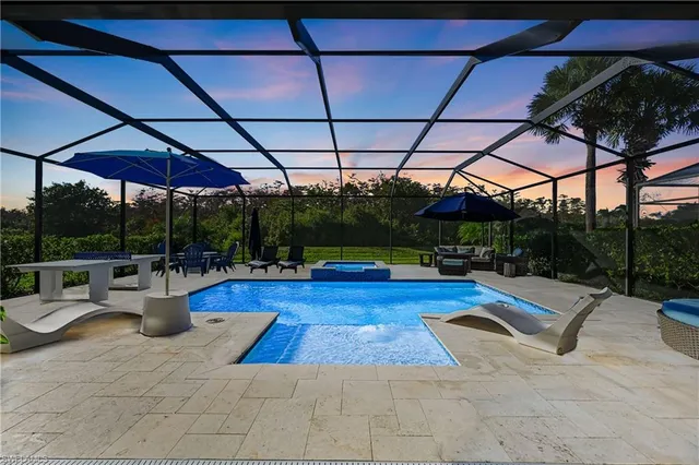 a view of swimming pool with sitting area