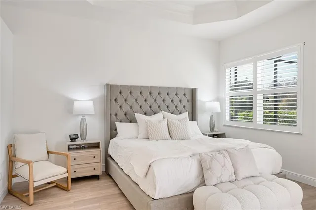 a bedroom with a bed and a couch