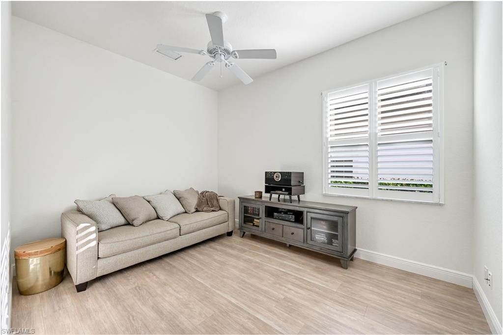 9121 Quartz Lane Naples, FL 34120 - Photo 19 of 36 Living room featuring light wood finished floors and a ceiling fan