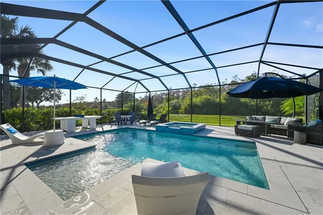 a view of a swimming pool with a patio