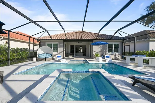 a view of a swimming pool with a patio