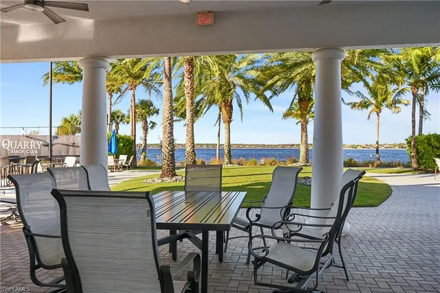 a view of swimming pool with outdoor seating