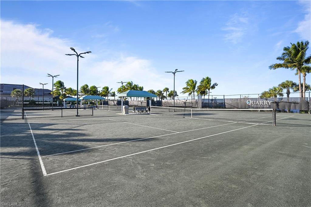 9121 Quartz Lane Naples, FL 34120 - Photo 31 of 36 View of tennis court featuring a gazebo and community basketball court