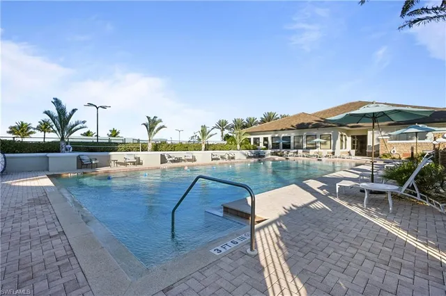 a view of a swimming pool with a patio