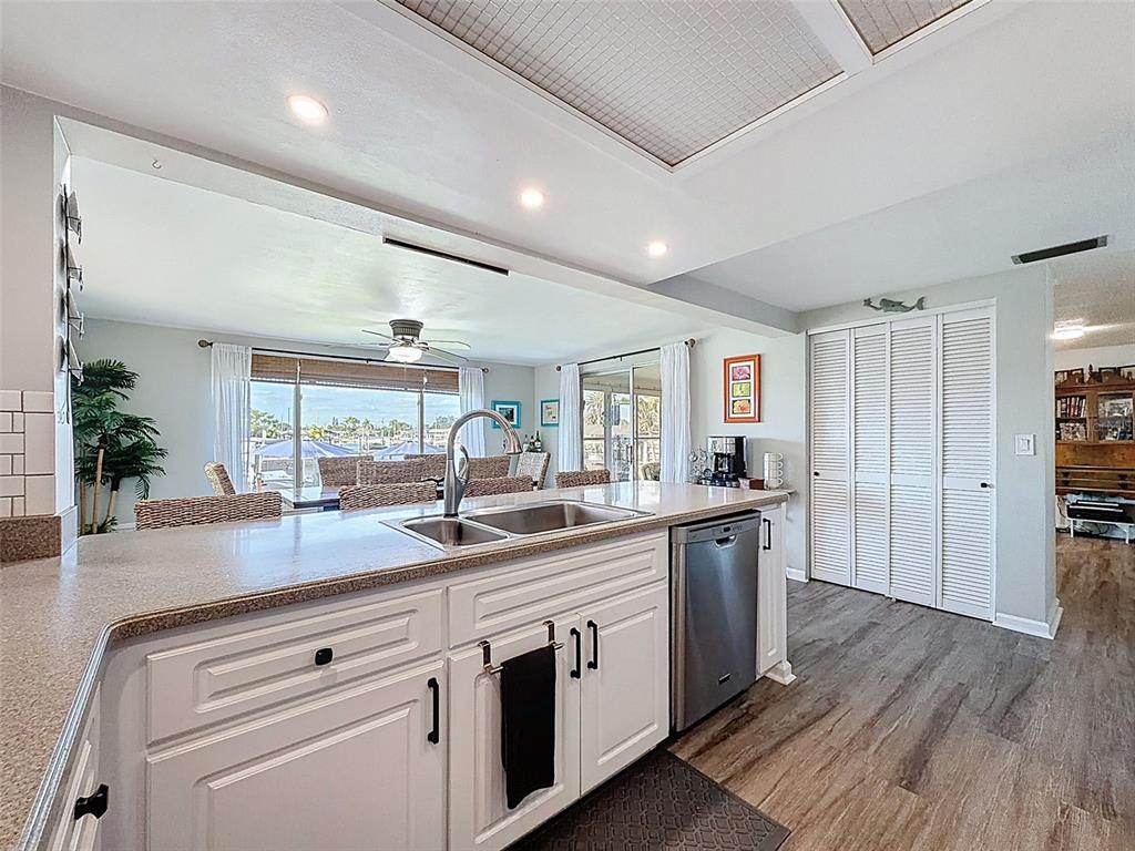 6521 Leeside Isle Hudson, FL 34667 - Photo 12 of 59 a kitchen with stainless steel appliances granite countertop a sink and stove top oven
