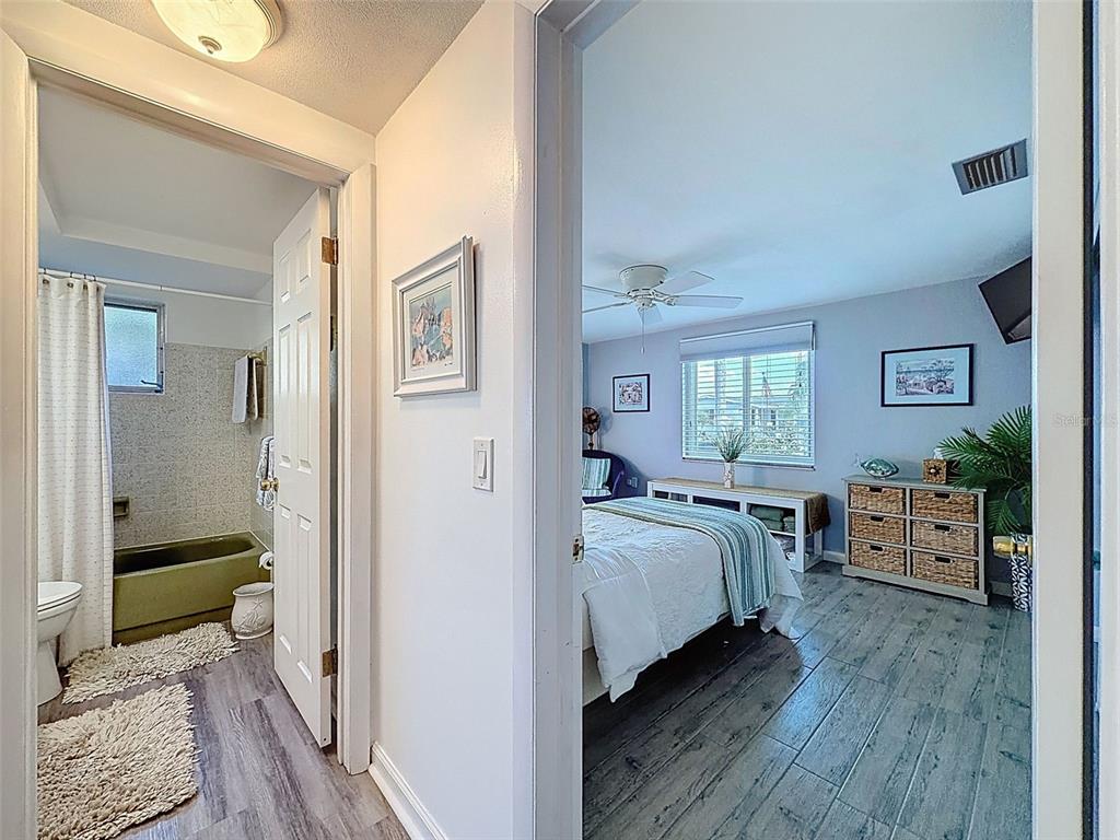 6521 Leeside Isle Hudson, FL 34667 - Photo 22 of 59 a bedroom with bed and window