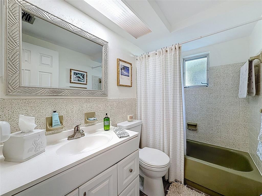 6521 Leeside Isle Hudson, FL 34667 - Photo 23 of 59 a bathroom with a sink a toilet and shower