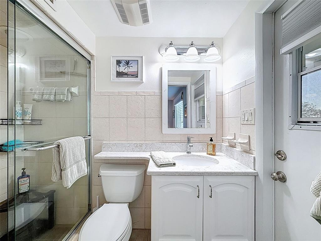 6521 Leeside Isle Hudson, FL 34667 - Photo 28 of 59 a bathroom with a toilet sink and mirror