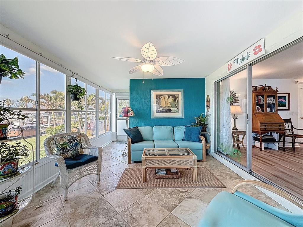 6521 Leeside Isle Hudson, FL 34667 - Photo 31 of 59 a living room with furniture and a large window