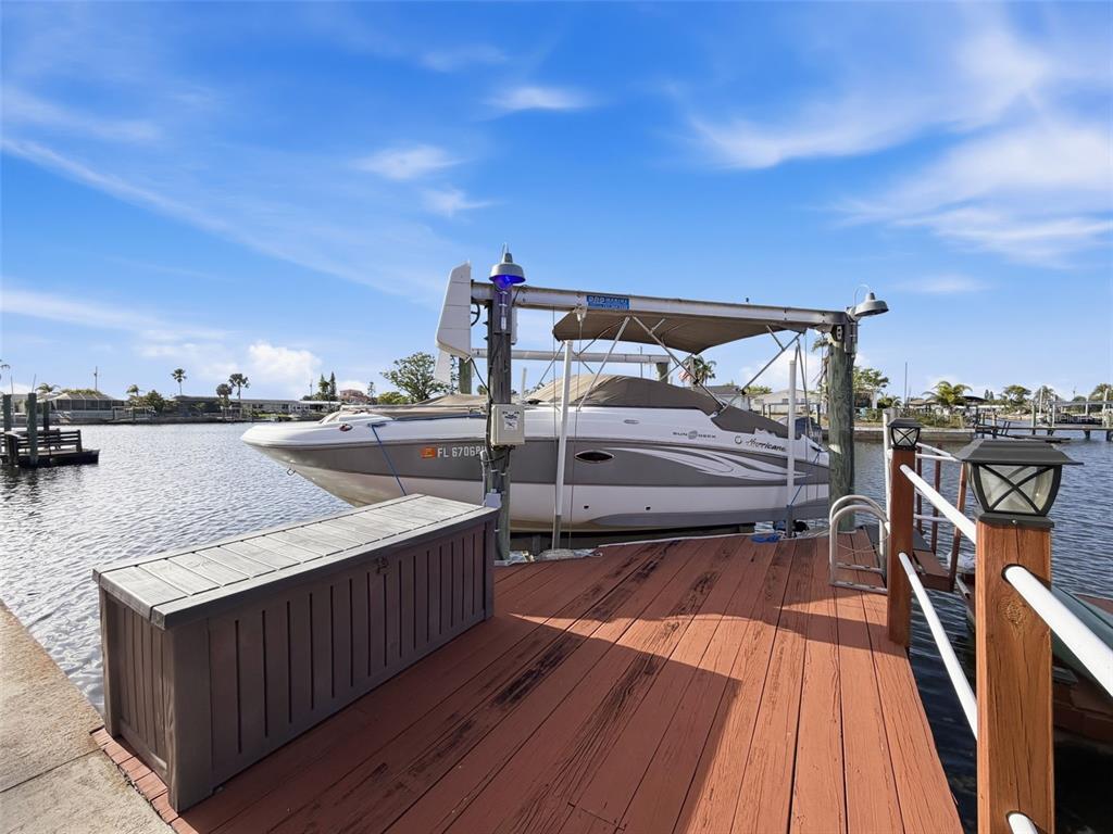 6521 Leeside Isle Hudson, FL 34667 - Photo 39 of 59 a terrace view with two chairs