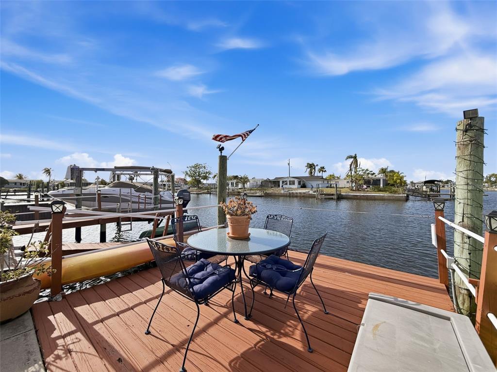 6521 Leeside Isle Hudson, FL 34667 - Photo 43 of 59 a terrace with outdoor seating and city view