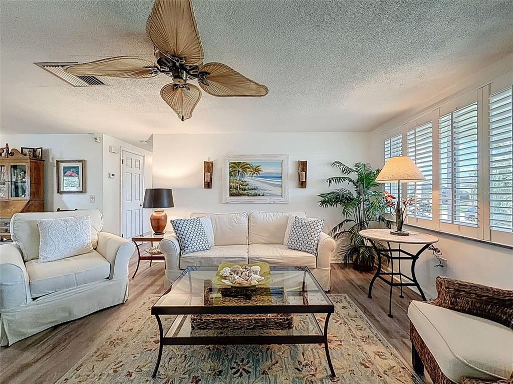 6521 Leeside Isle Hudson, FL 34667 - Photo 6 of 59 a living room with furniture and a window