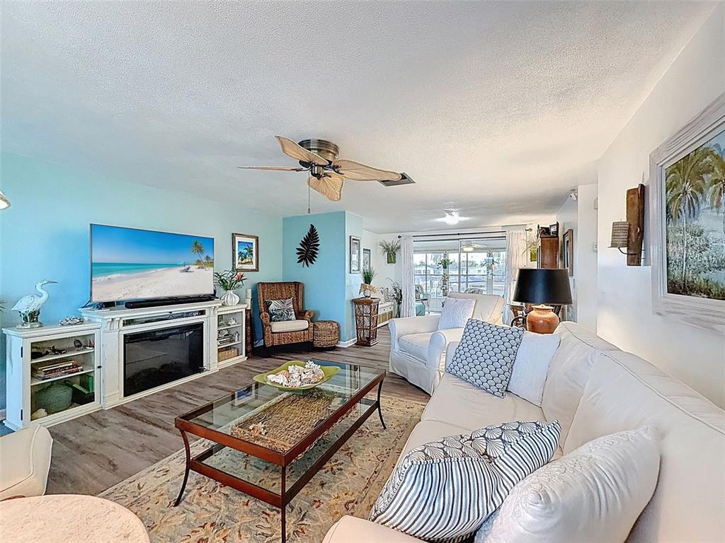 6521 Leeside Isle Hudson, FL 34667 - Photo 8 of 59 a living room with furniture and a fireplace