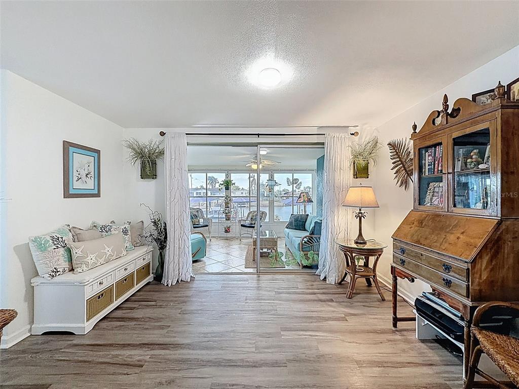 6521 Leeside Isle Hudson, FL 34667 - Photo 9 of 59 a living room with furniture and a wooden floor